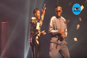 Medikal and Fella Makafui performing on stage