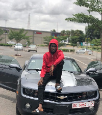 Rapper Ypee on his new hevrolet Camaro