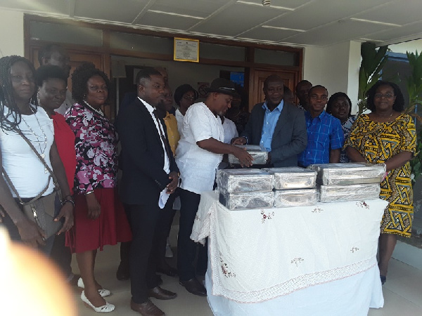 Dr Richard Anthony receiving medical equipment on behalf of Tema General Hospital