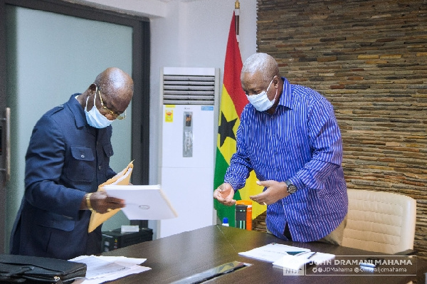 John Dramani Mahama receives the manifesto from the team