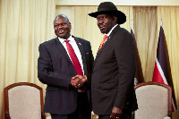 President Salva Kiir and Riek Machar shaking hands