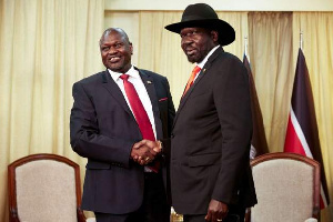 President Salva Kiir and Riek Machar shaking hands