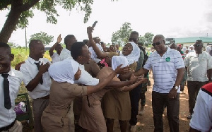 Former  President John Mahama with some nurses