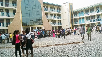 Aggrieved students clamour at the entrance of the examination hall