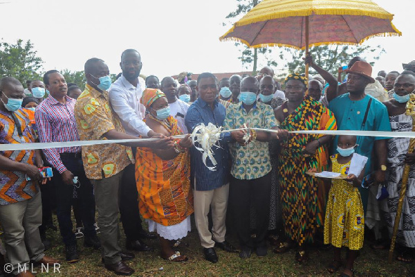 George Mireku Duker joined by elders of the community to cut the sod