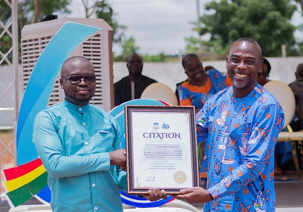 Joseph Kobla Wemakor receiving citation from Prof. Kwamena Kwansah-Aidoo, Rector of GIJ