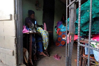 Kemi Adepoju, a dressmaker, sews a dress with a sewing machine in her shop amid the coronavirus