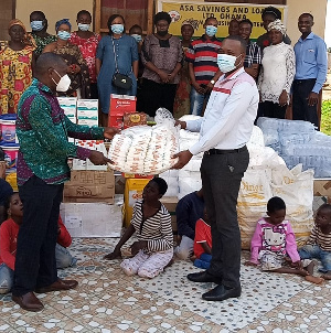 Sunyani Area Manager for ASA Savings and Loans presenting the items