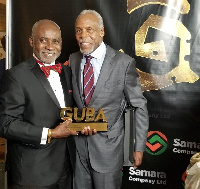 Prof. Oheneba Boachie-Adjei [L] after receiving his plaque