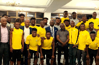 The GFA President in a pose with team members of the Black Meteors