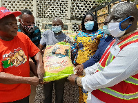 Tangoba Abayage, Jerry Asamani receiving a sample of the items from Officials of VRA and NEDCo