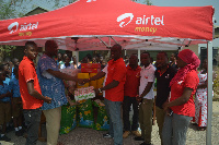 Kwame Osafo-Amoah, Airtel Ghana presents  to Mr. Christopher Luguterah, Director of SOS Children