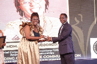 Ms Sophia Kudjordji receiving her trophy