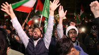 Iranian demonstrators in Tehran react after the Iranian attack on Israel