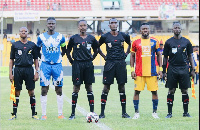 Lineup of match officials and skippers before game