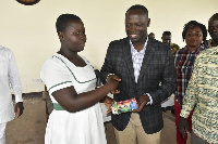 Armah-Kofi Buah presenting the mathset to one of the students