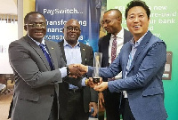 GOC boss, Nunoo-Mensah (L) in a handshake with Payswitch