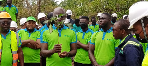 Mr. Samuel Kofi Dzamesi and some staff of BPA planting trees