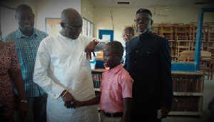 Joseph Kofi Adda with the 12-year-old boy