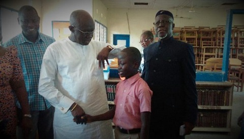 Joseph Kofi Adda with the 12-year-old boy