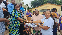 The headmistress receives the tablets on behalf of the school