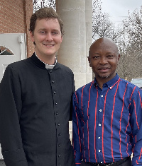 Ras Mubarak shares a photo with the priest at the St. Lauren Anglican Church in Texas