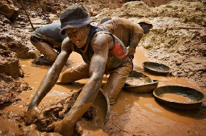 File Photo : A man working in a mining pit