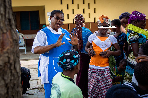 File photo: A healthcare personnel educating some teenagers