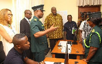 Assistant Commisioner of Immigration, Samue Basantale briefing some dignitaries about the facility