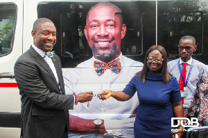 Okoe-Boye handing over the keys of the bus to the management of LEKMA Hospital