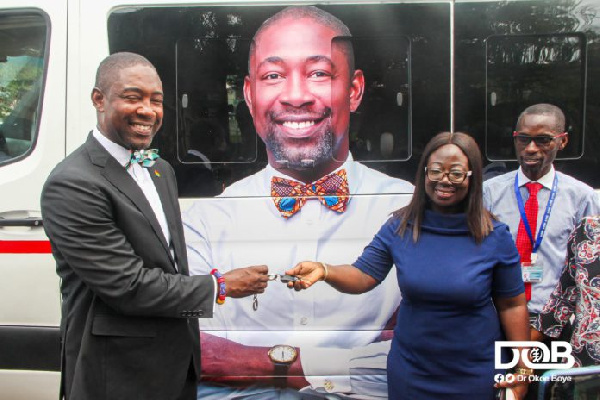 Okoe-Boye handing over the keys of the bus to the management of LEKMA Hospital