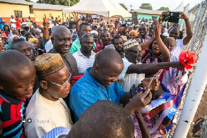 Samuel Abu Jinapor cutting the tape to the 16-seater ultramodern water closet toilet