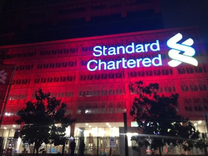 Standard Chartered Bank Ghana head office in Accra shinning red