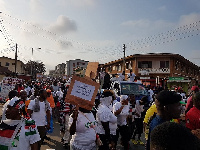 Scores of party supporters and executives are marching through the streets of Accra