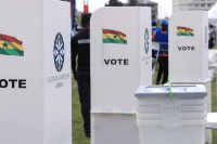 File: An EC official arranges the chairs for voters