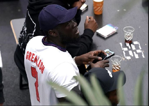 Rapper Stormzy in his England replica jersey