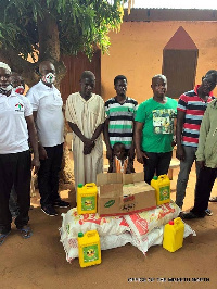 Dr. James Avedzi (in customized NDC nosemask) with Islamic leader in Tadzewu