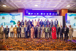 A group picture of participants and guest speakers at the event