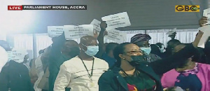 Minority members chanting songs during the State of Nation Address