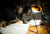 Uganda students studying with a Solar Lantern