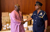 Dr Bampoe shakes DCOP Ampah Benin Director General Public Affairs of the Ghana Police Service