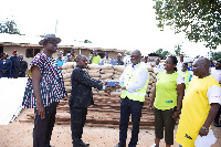 Vivo Energy Ghana MD, Ben Hassan Ouattara [R] presenting building materials