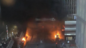 Vehicles and bins burned in a street aside the Gare de Lyon rail station in Paris on February 28.