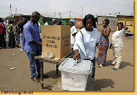 Woman casts her ballot.     File photo.