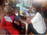 A resident of Tema going through a health screening