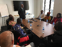 Some of the farmers being briefed by an official of Ghana Cocoa Marketing Company(UK) Ltd