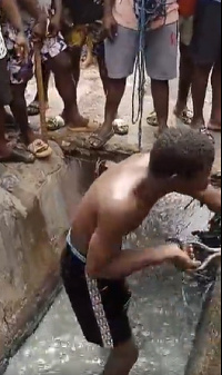 The young man is seen here cleaning the gutter