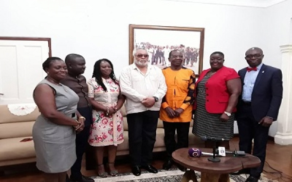 Former President Rawlings in a photo with some members of the GJA