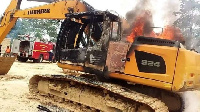 An excavator set ablaze