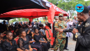 Ajos singing to widow of the late Major Maxwell Mahama